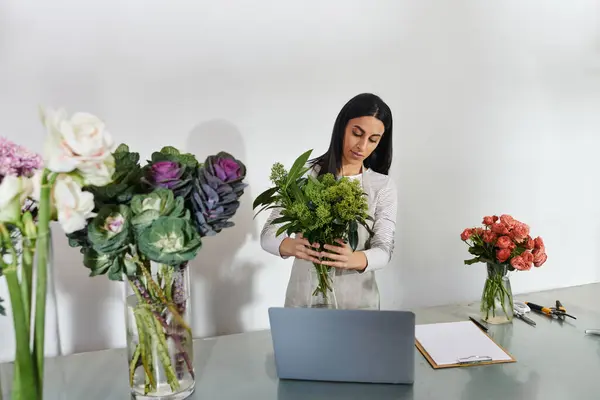 Florist expertly combines fresh blooms while managing her small business with passion. — Stock Photo