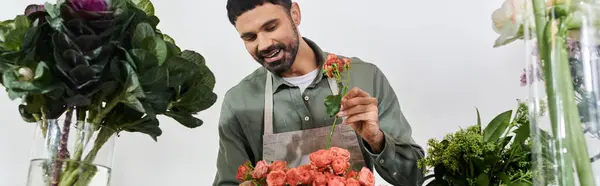 A skilled florist artfully arranges vibrant flowers in his charming shop, showcasing creativity, banner — Stock Photo