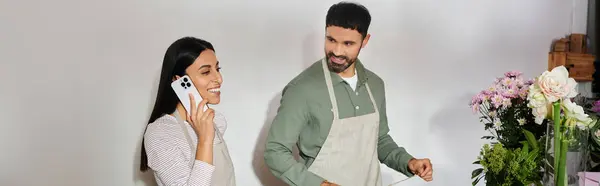 Married couple collaborates in their flower shop, arranging blooms and sharing smiles, banner — Stock Photo