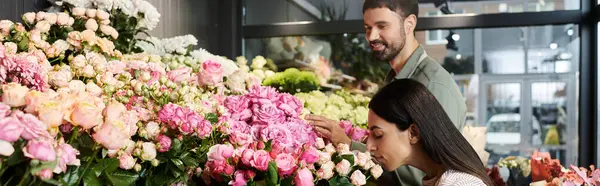 Husband and wife work together to arrange beautiful flowers for their customers in the shop, banner — Stock Photo