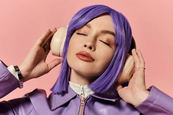 A beautiful woman with purple hair relaxes while listening to music, showcasing her vibrant style. — Stock Photo