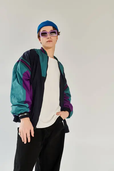Confident young man showcases fashion in a studio setting during college years. — Stock Photo