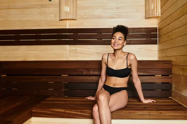 Relaxation and wellbeing come together as a spirited young woman enjoys her time at the spa. — Stock Photo