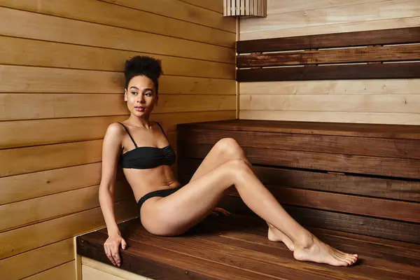 Radiating calmness, a young African American woman indulges in a serene spa experience. — Stock Photo