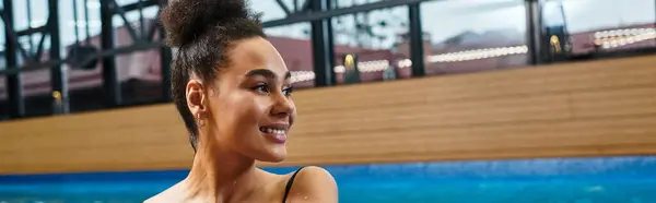 A beautiful young woman unwinds at a tranquil spa, embracing relaxation and blissful wellbeing. — Stock Photo