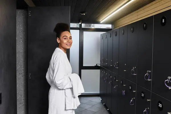 A young chic woman smiles, enjoying relaxation and wellbeing at the spa. — Stock Photo