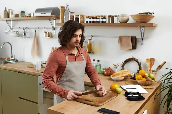 A young man with diabetes prepares a nutritious meal in his stylish kitchen, focusing on wellness. — Stock Photo