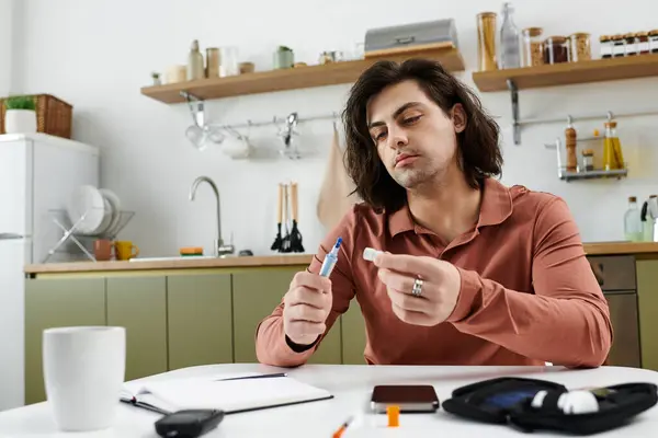 This young man navigates his daily routine managing diabetes in a stylish apartment. — Stock Photo