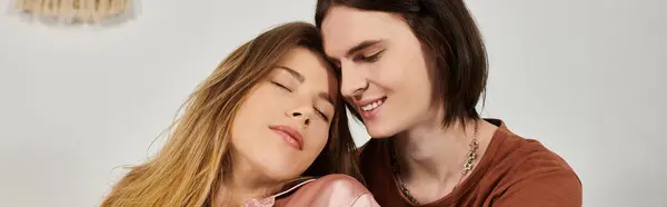 Two young people relax closely together, enjoying a warm and intimate atmosphere of connection. — Stock Photo