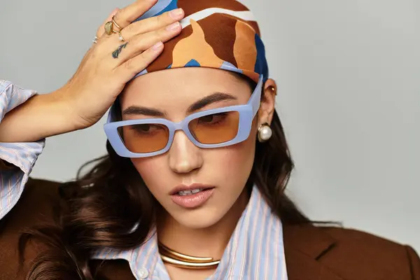 Young woman displays unique style with bold accessories and a confident, radiant beauty. — Stock Photo