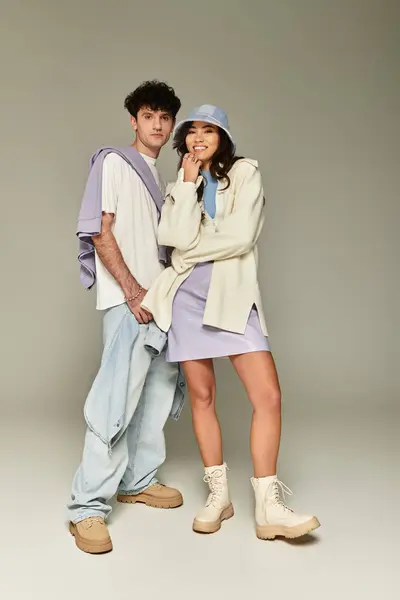Young pair exudes confidence in trendy outfits, radiating style and contemporary vibes together. — Stock Photo