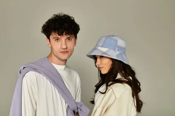 Young fashion enthusiasts express their trendy style in a creative setting. — Stock Photo
