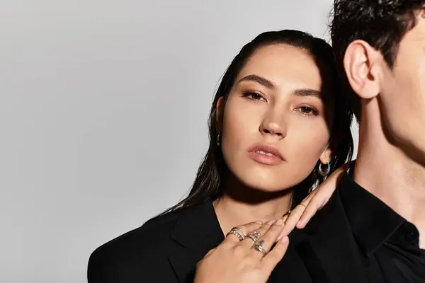 Young fashion forward individuals display confidence and style in a sleek, contemporary setting. — Stock Photo