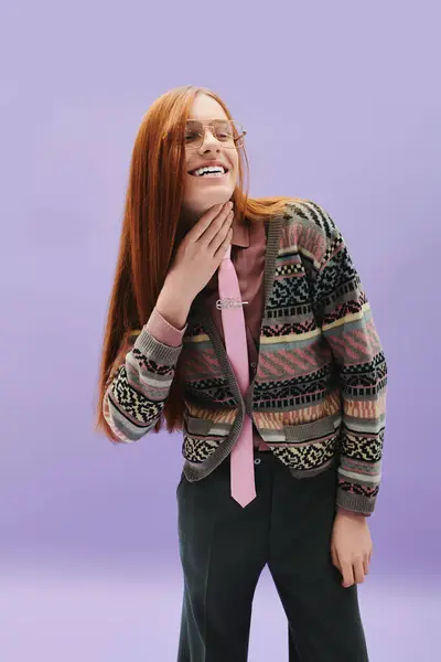 A young queer man with striking red hair embraces fashion, smiling and showcasing his style. — Stock Photo