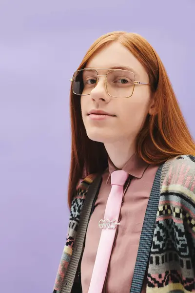 A fashionable young man with red hair showcases modern style while smiling in vibrant attire. — Stock Photo
