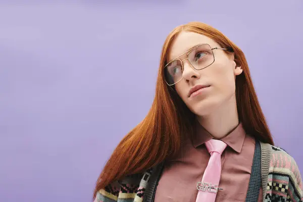 A confident young man with red hair and trendy glasses flaunts his unique style creatively. — Stock Photo