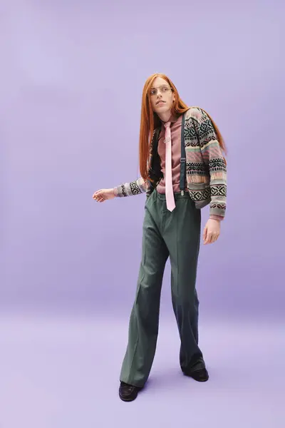 A young man with long red hair confidently poses in stylish attire, showcasing contemporary fashion. — Stock Photo
