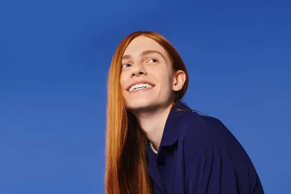 A handsome young individual with red hair showcases their unique style and joyful spirit. — Stock Photo