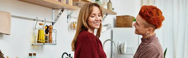 Two beautiful young women share joyful moments in their stylish home, embracing love and connection, banner — Stock Photo