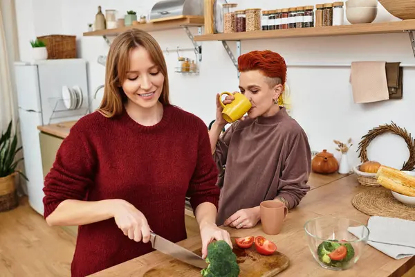 Two young women enjoy a fun cooking experience together at home. — Stock Photo