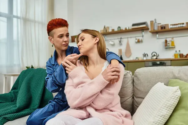 Two young women share a loving moment in their chic apartment. — Stock Photo