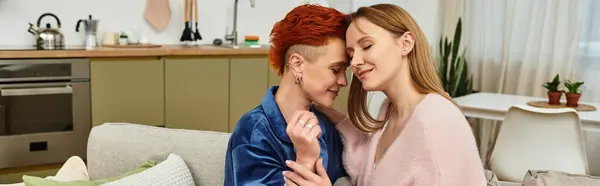 Two beautiful young women share a tender moment in their cozy apartment, radiating love and joy, banner — Fotografia de Stock