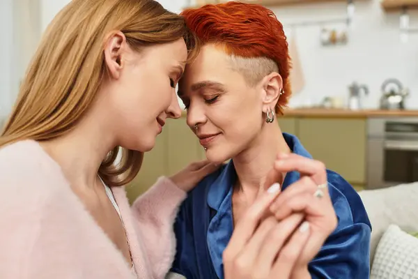 A beautiful couple enjoys intimate moments in a modern apartment, embracing love and diversity. — Stock Photo