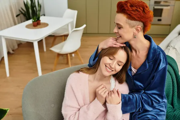 Two young women enjoy each other's company, showcasing love and happiness in a cozy space. — Stock Photo