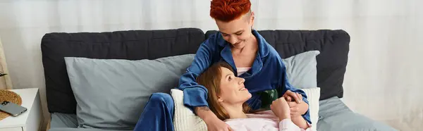 Two young women share a tender moment in their stylish apartment, embracing love and joy, banner — Stock Photo