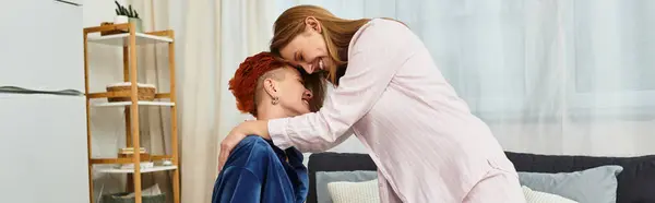 Two beautiful women embrace joyfully in their stylish apartment, radiating love and connection, banner — Stock Photo