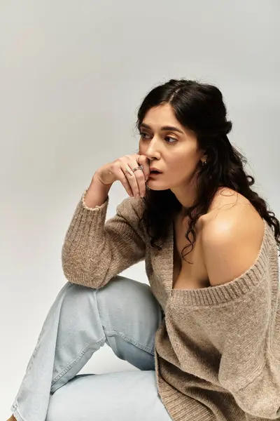 Capturing confidence with a young plus size woman in a beige sweater. — Stock Photo