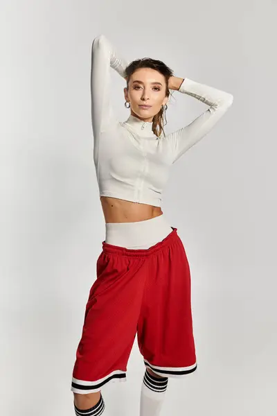Young beautiful woman showcasing trendy fashion in chic athleisure style for a modern look. — Stock Photo