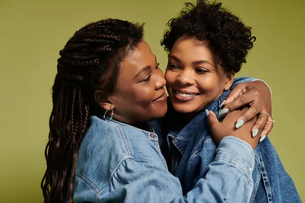 Loving couple in trendy denim jackets smiles at each other, showcasing their beautiful bond. — Stock Photo