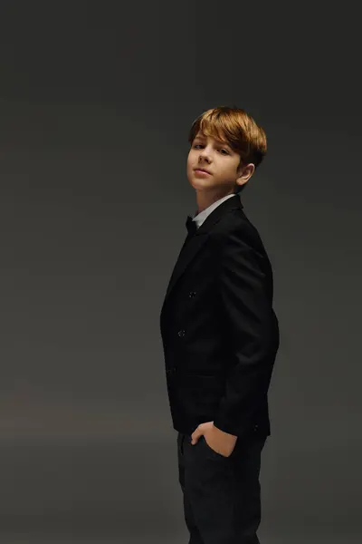 A preteen boy stands confidently in elegant attire, capturing the essence of children fashion. — Stock Photo