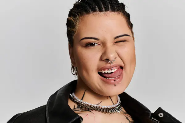 A young woman with braided hair expresses her unique style through fashion and attitude. — Stock Photo