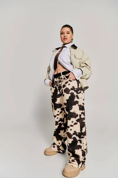 Young woman showcases her unique fashion sense with a trendy outfit in a modern environment. — Stock Photo