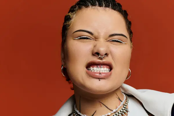 Confident young woman showcases her unique style with bold accessories and a playful expression. — Stock Photo