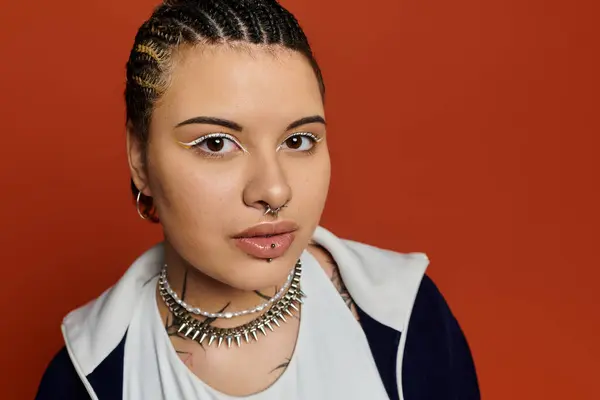 Young woman showcases a unique style with braided hair and chic accessories, exuding modern flair. — Stock Photo