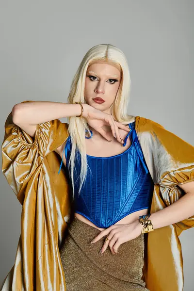 A confident drag queen poses dramatically in bold, trendy attire, radiating vibrant energy. — Stock Photo