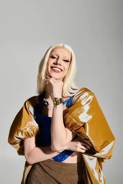 A chic drag queen flaunts a vibrant outfit with unique textures in a fun pose. — Stock Photo