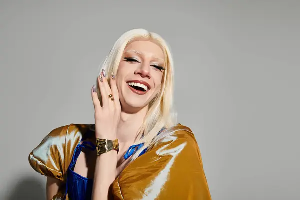 This stylish young drag queen radiates confidence and charm with a dazzling smile and trendy outfit. — Stock Photo