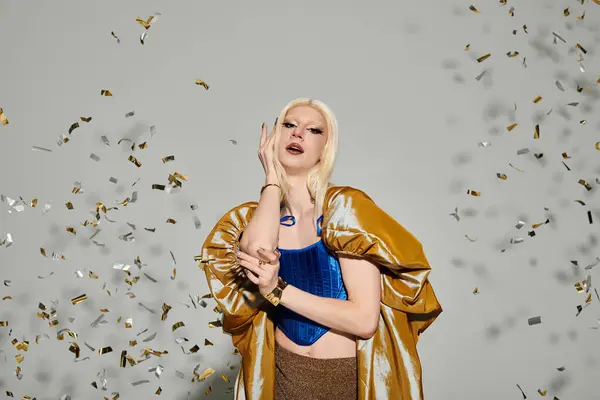 A chic drag queen showcases their style in a festive, confetti filled celebration. — Stock Photo