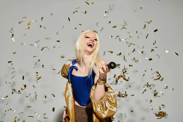 A fashionable drag queen joyfully embraces life while reveling in a burst of colorful confetti. — Stock Photo