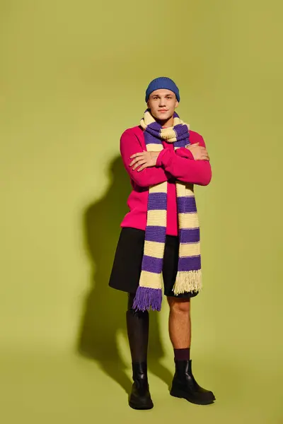 A stylish young man confidently showcases his prosthetic leg in a studio setting. — Stock Photo