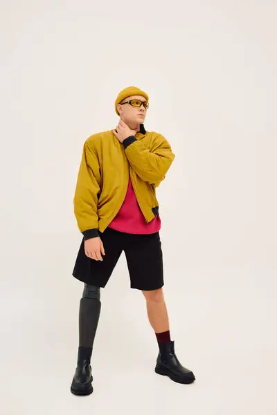 Handsome young man confidently poses in trendy attire, highlighting diversity and inclusion. — Stock Photo