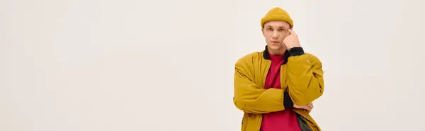 A fashionable young man poses confidently in stylish attire, showcasing modern trends, banner — Stock Photo