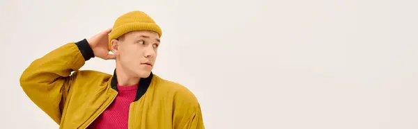 Handsome young man poses confidently in fashionable attire while striking a stylish look, banner — Stock Photo