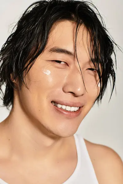 Charming young asian male displays trendy fashion sense with natural charisma and confidence. — Stock Photo