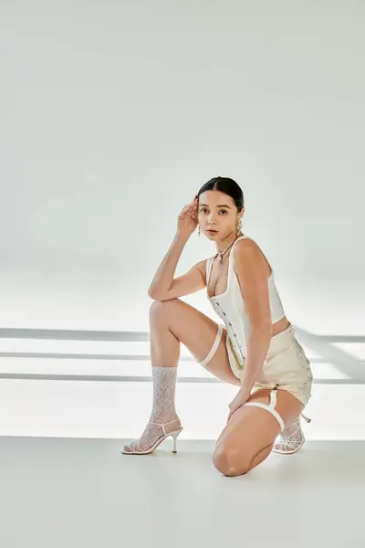 Elegant gymnast showcases style and sport in a chic setting. — Stock Photo