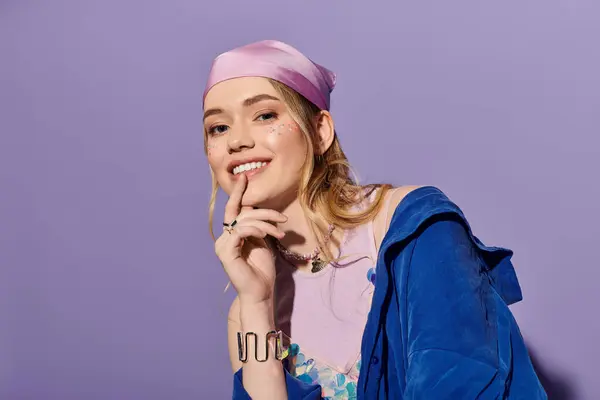 Stylish woman poses playfully in trendy attire, radiating joy in a bright, colorful space — Stock Photo